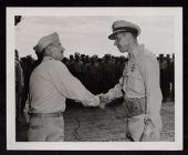Capt. Frank Ackers shaking hand with another man